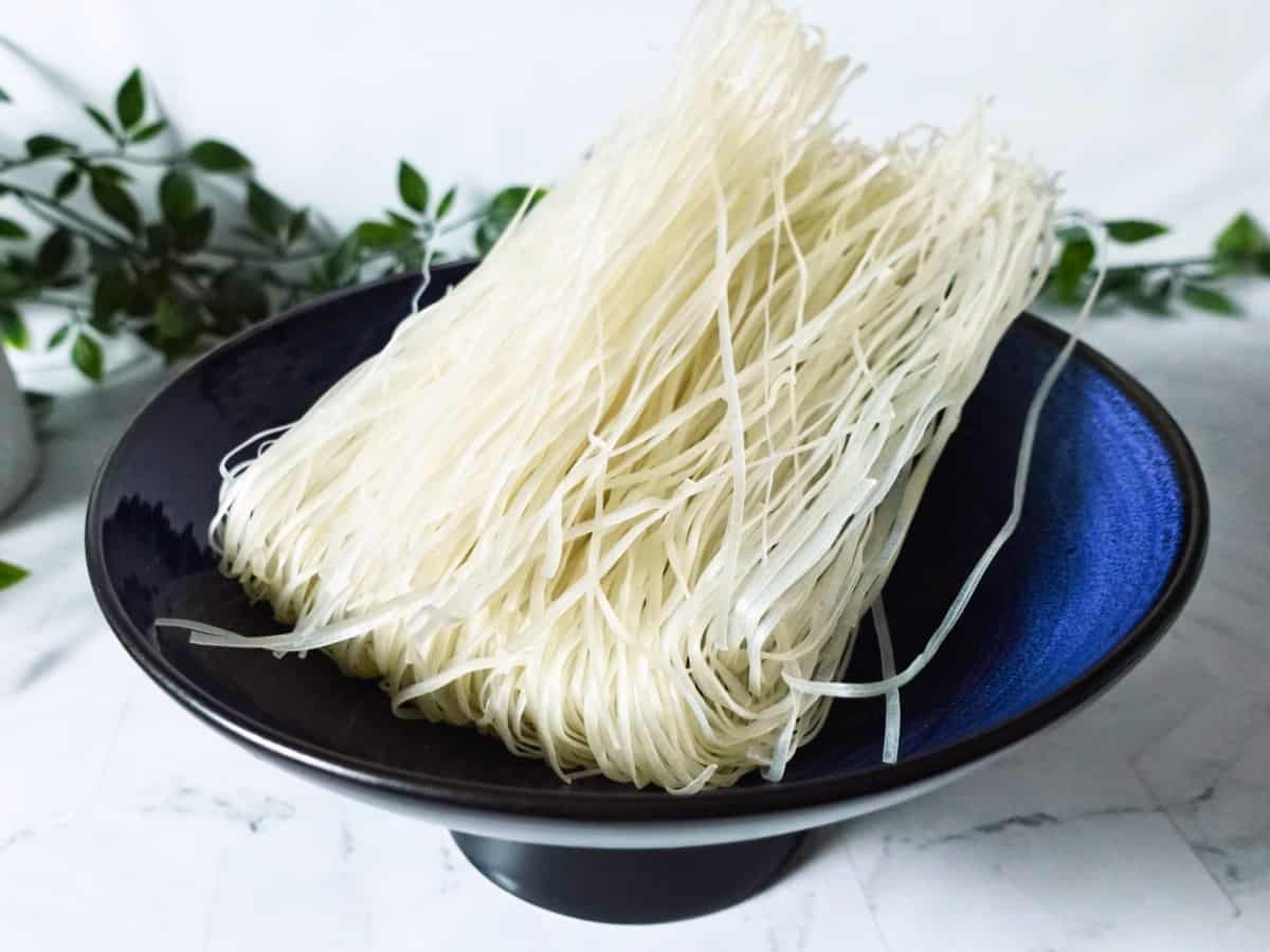 uncooked rice stick noodles in a bowl