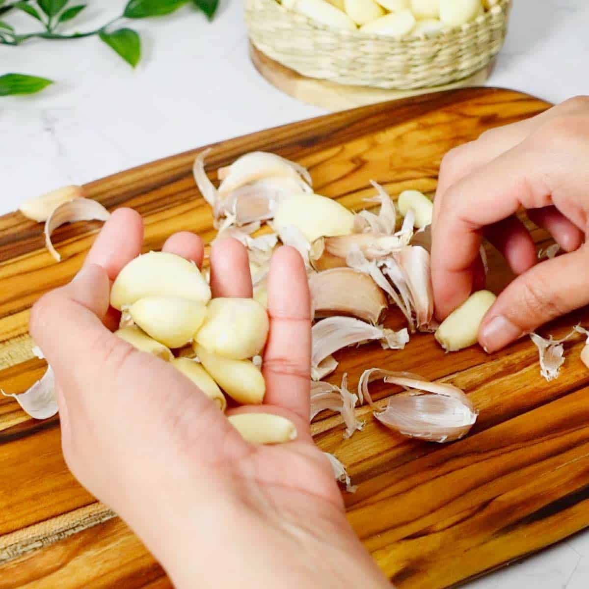 Picking out peeled cloves of garlic.