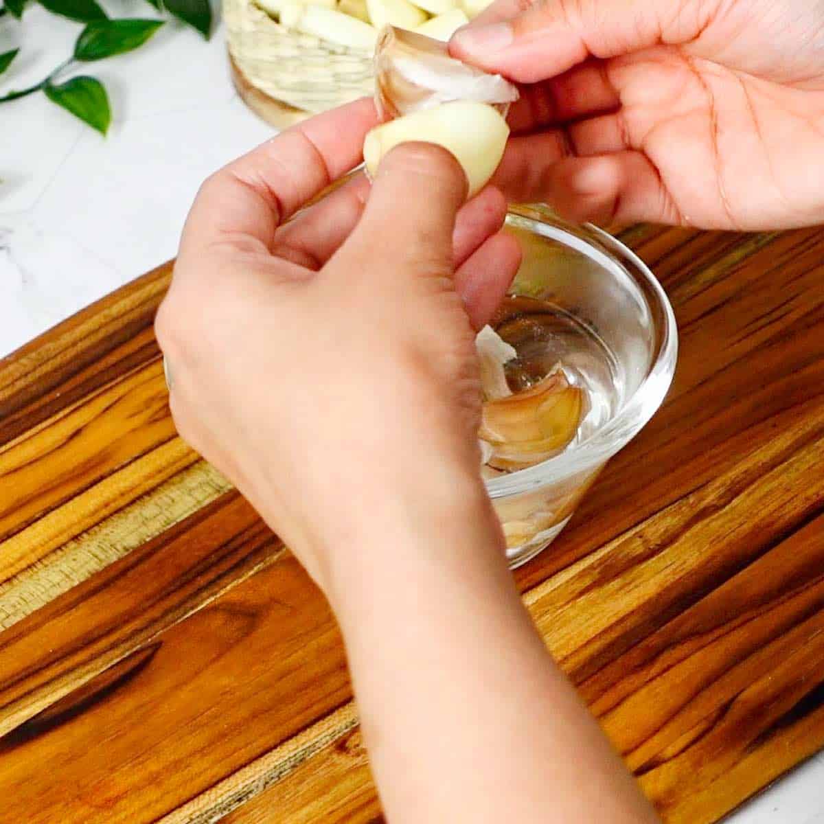Removing the garlic peel.