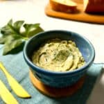 a bowl filled with garlic butter that's made using garlic powder