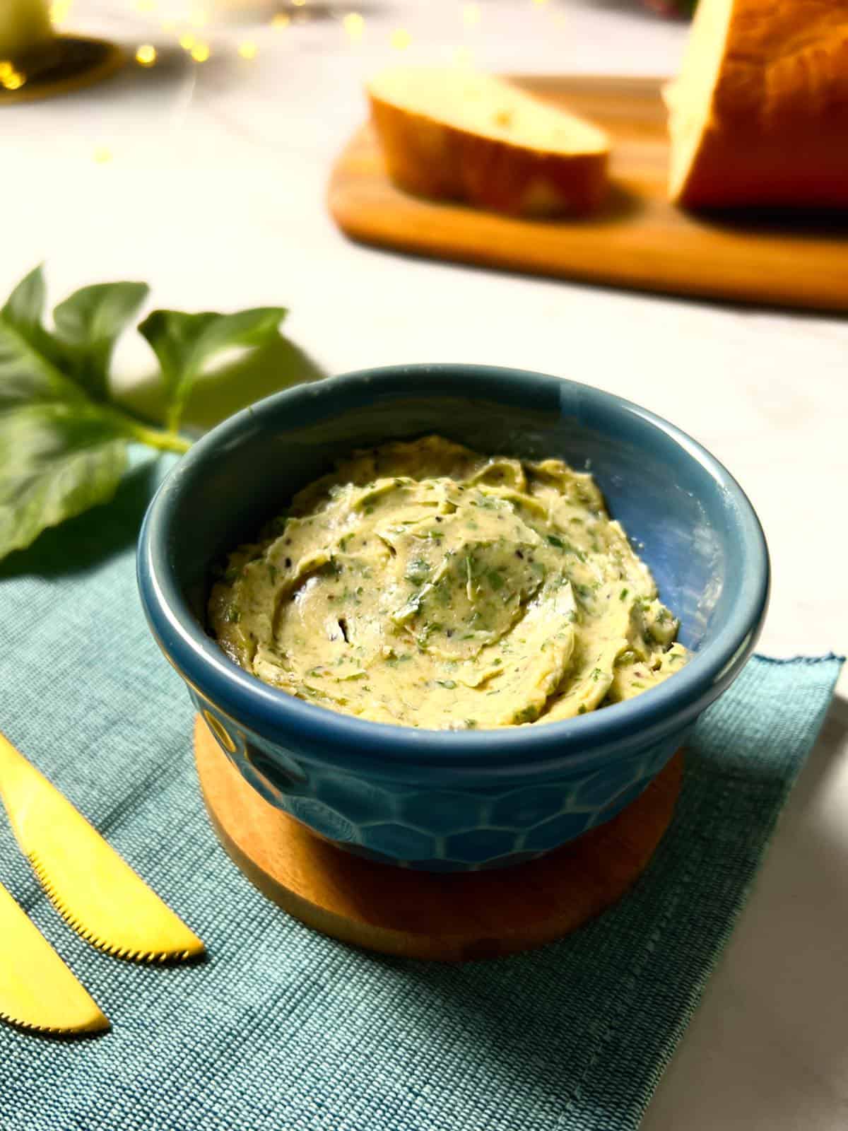 a bowl containing garlic butter that's made with garlic powder