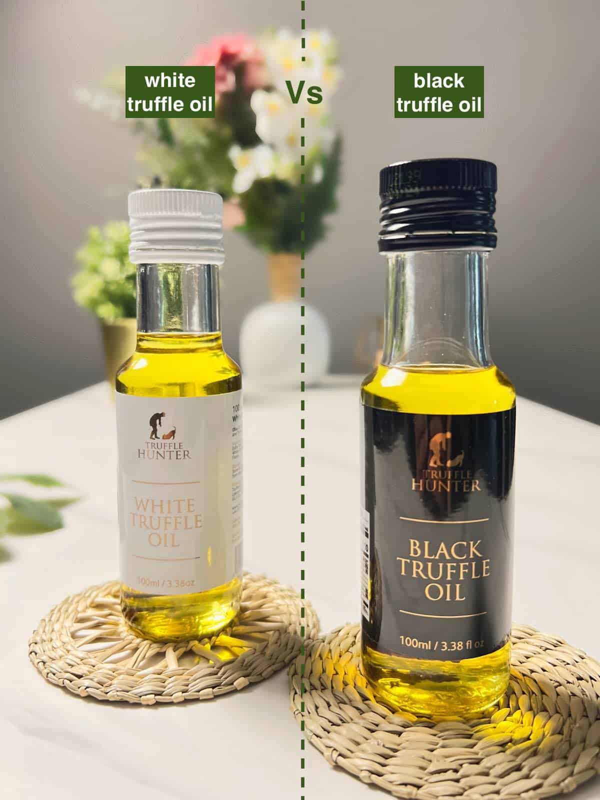 a bottle of white truffle oil alongside a bottle of black truffle oil