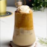 a glass of coffee float topped with a scoop of ice cream