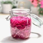 a jar full of pickled purple cabbage