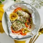 a plate of haddock that's baked in foil