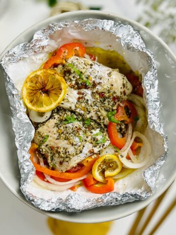 a plate of haddock that's baked in foil