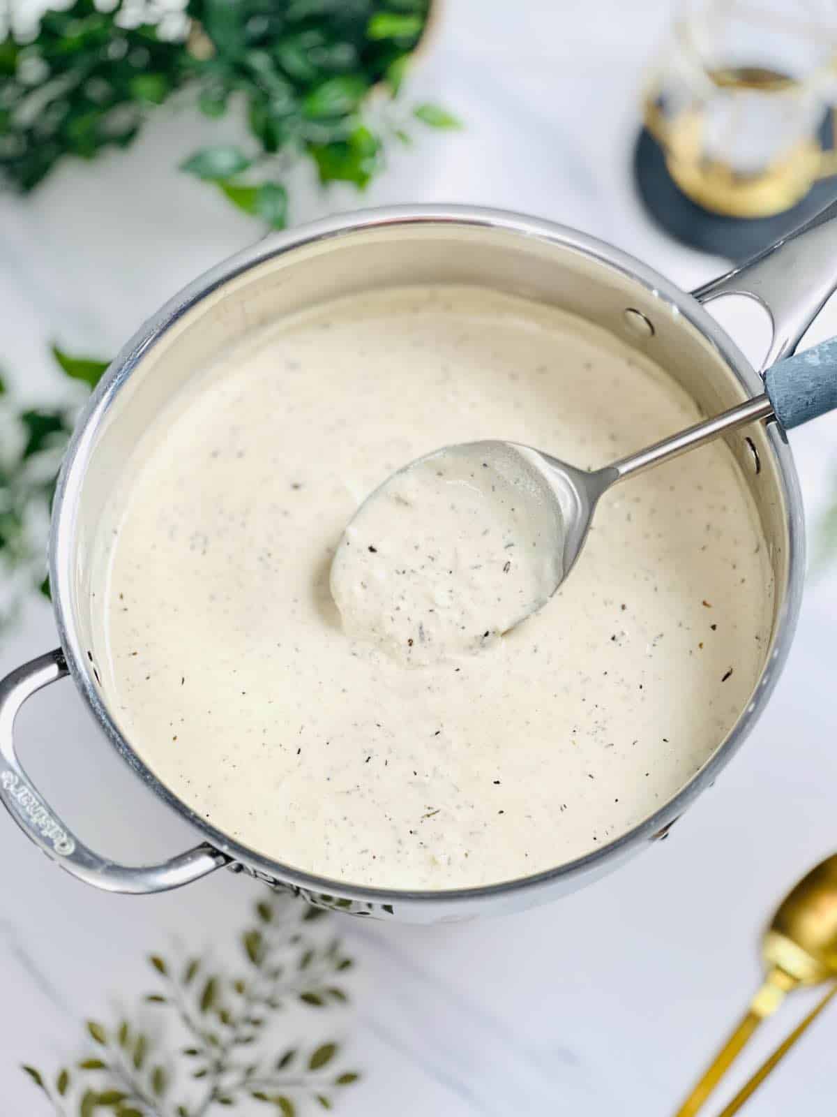 a skillet with truffle cream sauce in it