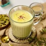 a cup containing cardamom milk