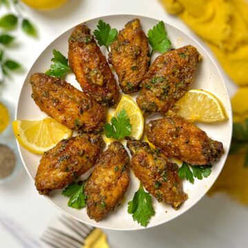 a plate of garlic lemon pepper wings