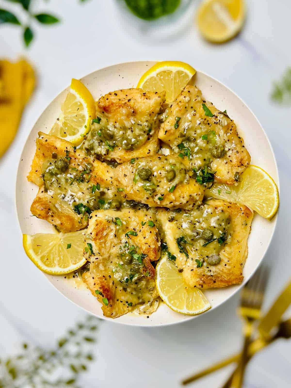 a plate of haddock piccata