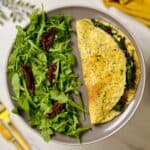 a plate containing arugula omelette