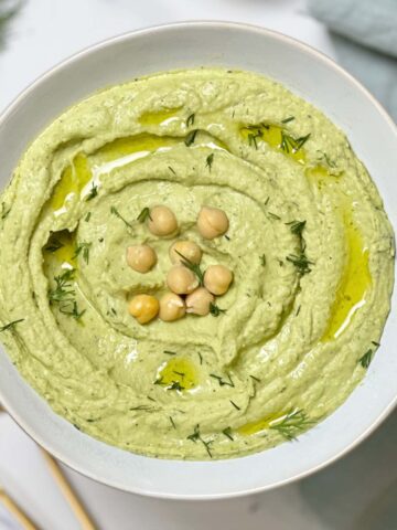 lemon dill hummus topped with some chickpeas