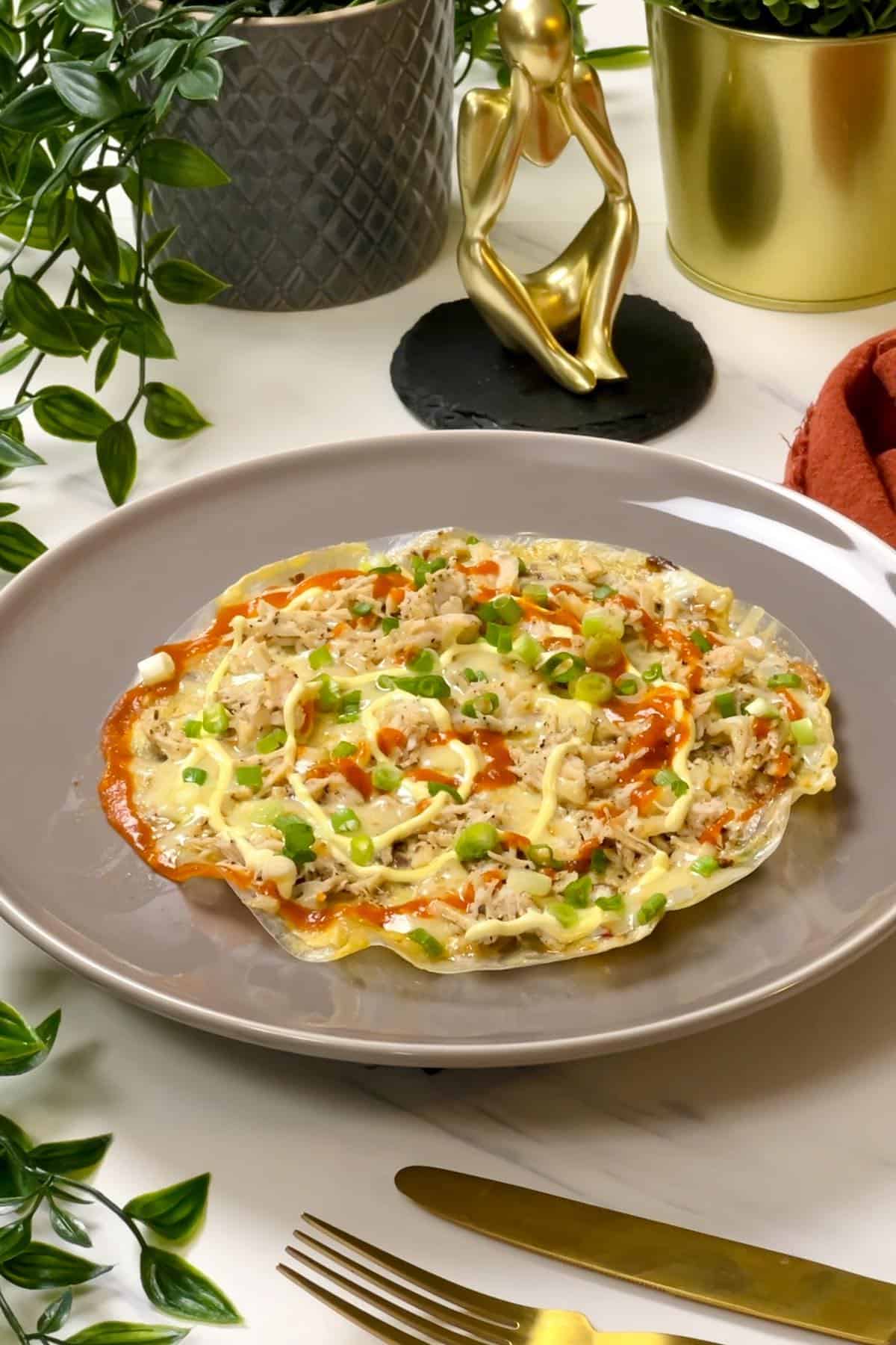 opened faced rice paper omelette served on a plate