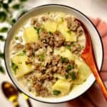 ground beef and potato soup in a bowl