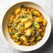 a plate of delicious ground beef pesto gnocchi