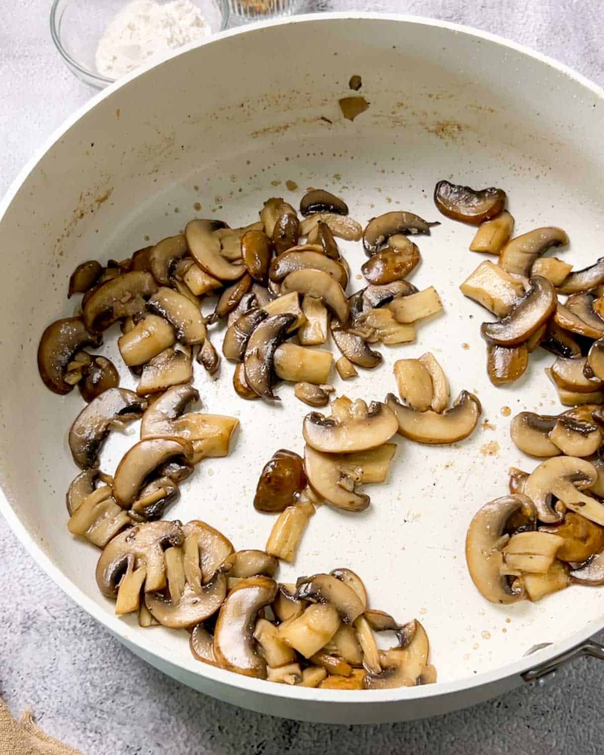 cooking sliced mushrooms