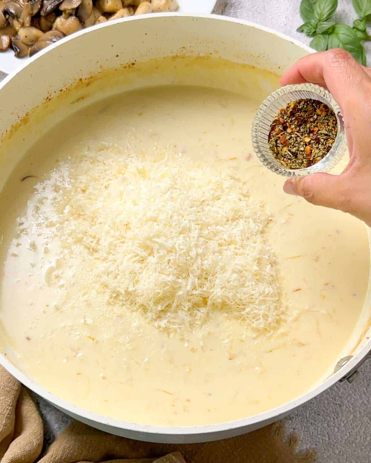 adding parmesan and seasonings