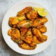garlic lime chickens wings on a plate