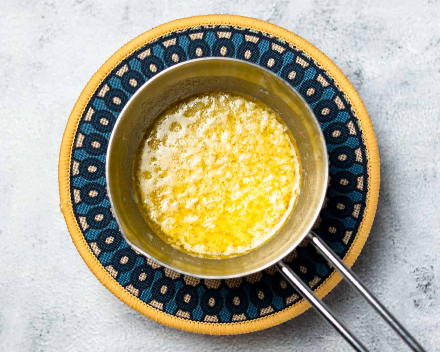 grated garlic cooking in butter