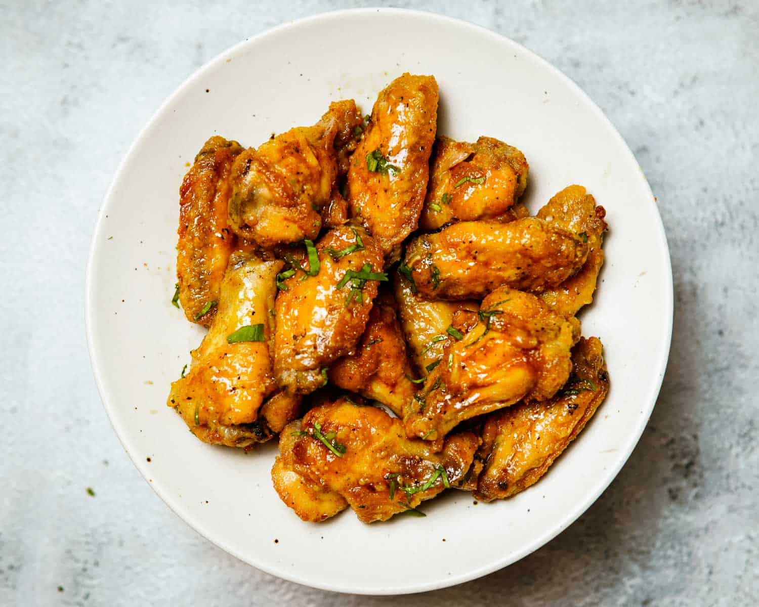 cooked chicken wings tossed with garlic lime sauce