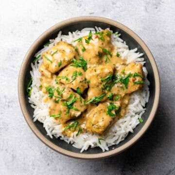 creamy garlic lime chicken served on a bed of rice in a bowl