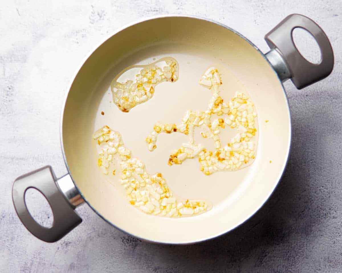 chopped onion cooking in a saucepan