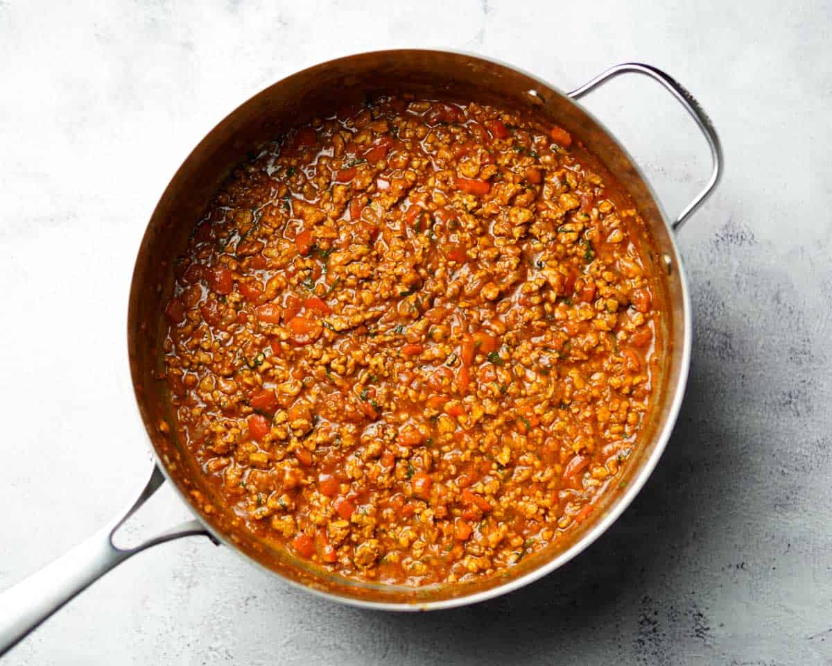 skillet containing ground chicken taco sauce