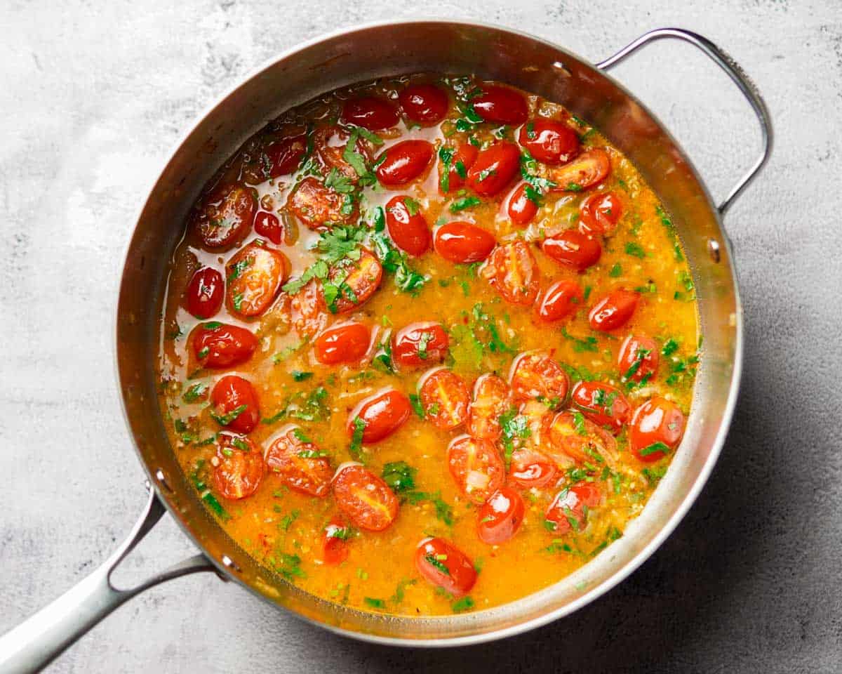 delicious cherry tomato sauce cooking in a skillet