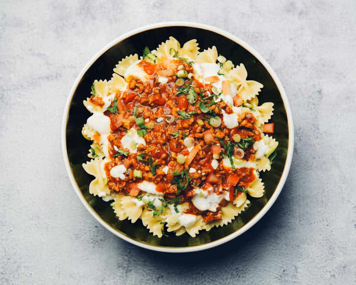 pasta dish with layers of pasta, yogurt and chicken taco sauce