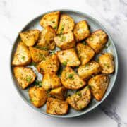 lemon dill potatoes served on a plate