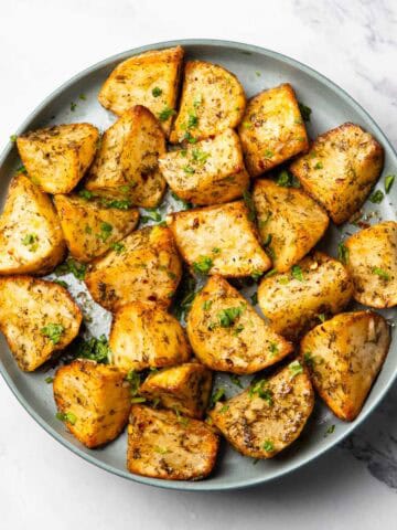 lemon dill potatoes served on a plate