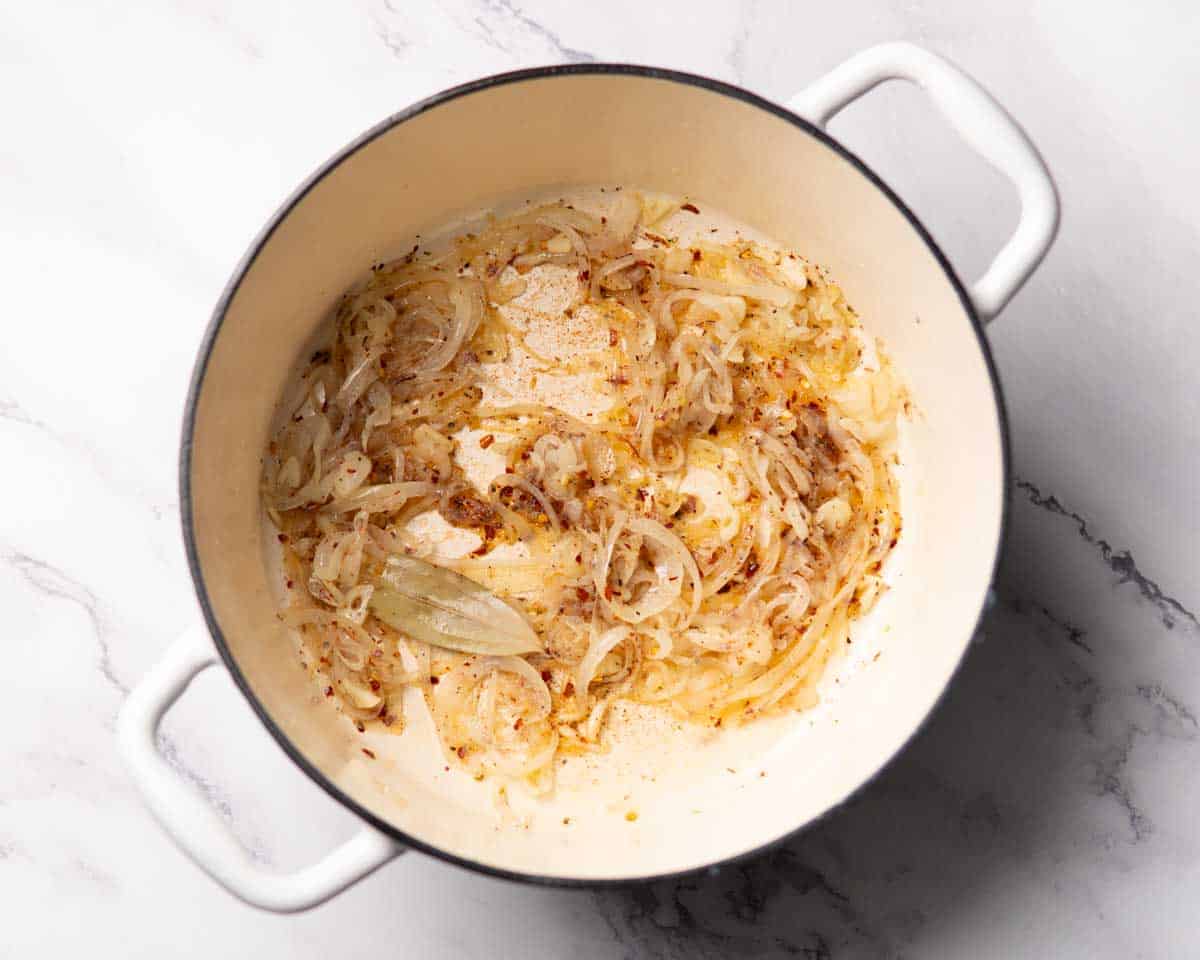 seasonings cooking with sautéed onion and garlic