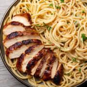 jerk chicken pasta served on a plate