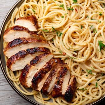 jerk chicken pasta served on a plate